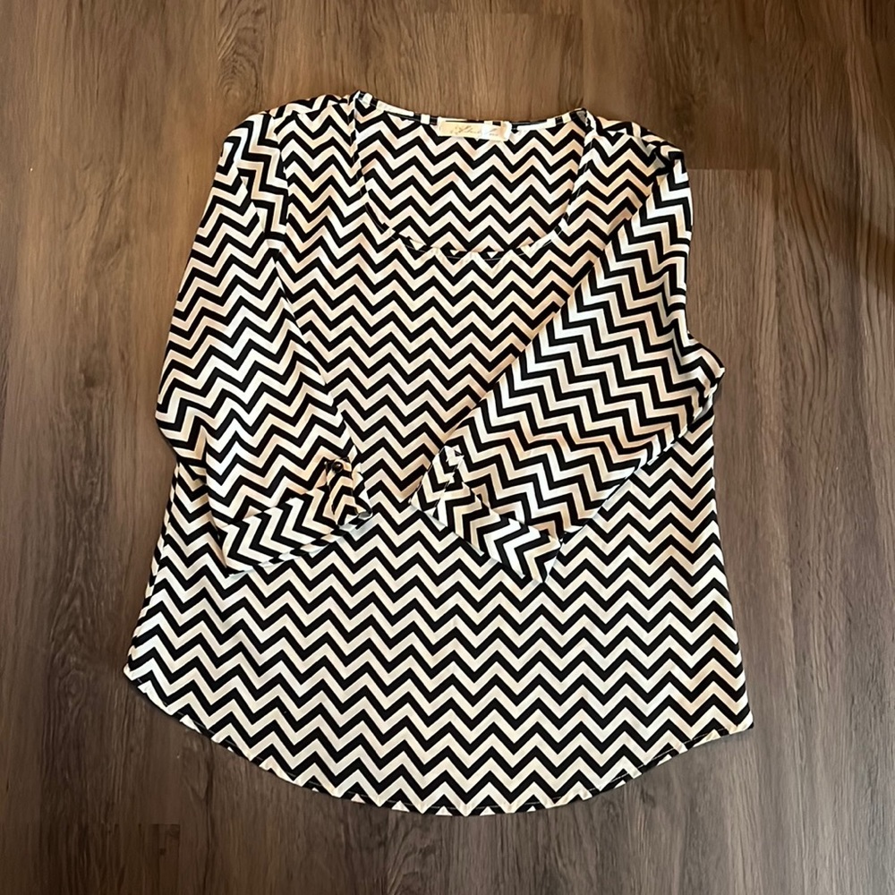 Black & white Chevron blouse. Dress it up or dress down. Super cute blouse